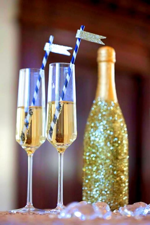 A glass of sparkling with sparkly straws! NYE glam